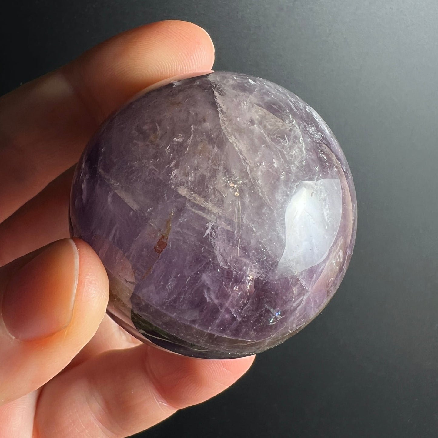 Super Seven Kugel 48mm violett-transparent mit Einschlüssen, poliert, Melody Stone | Happy Minerals